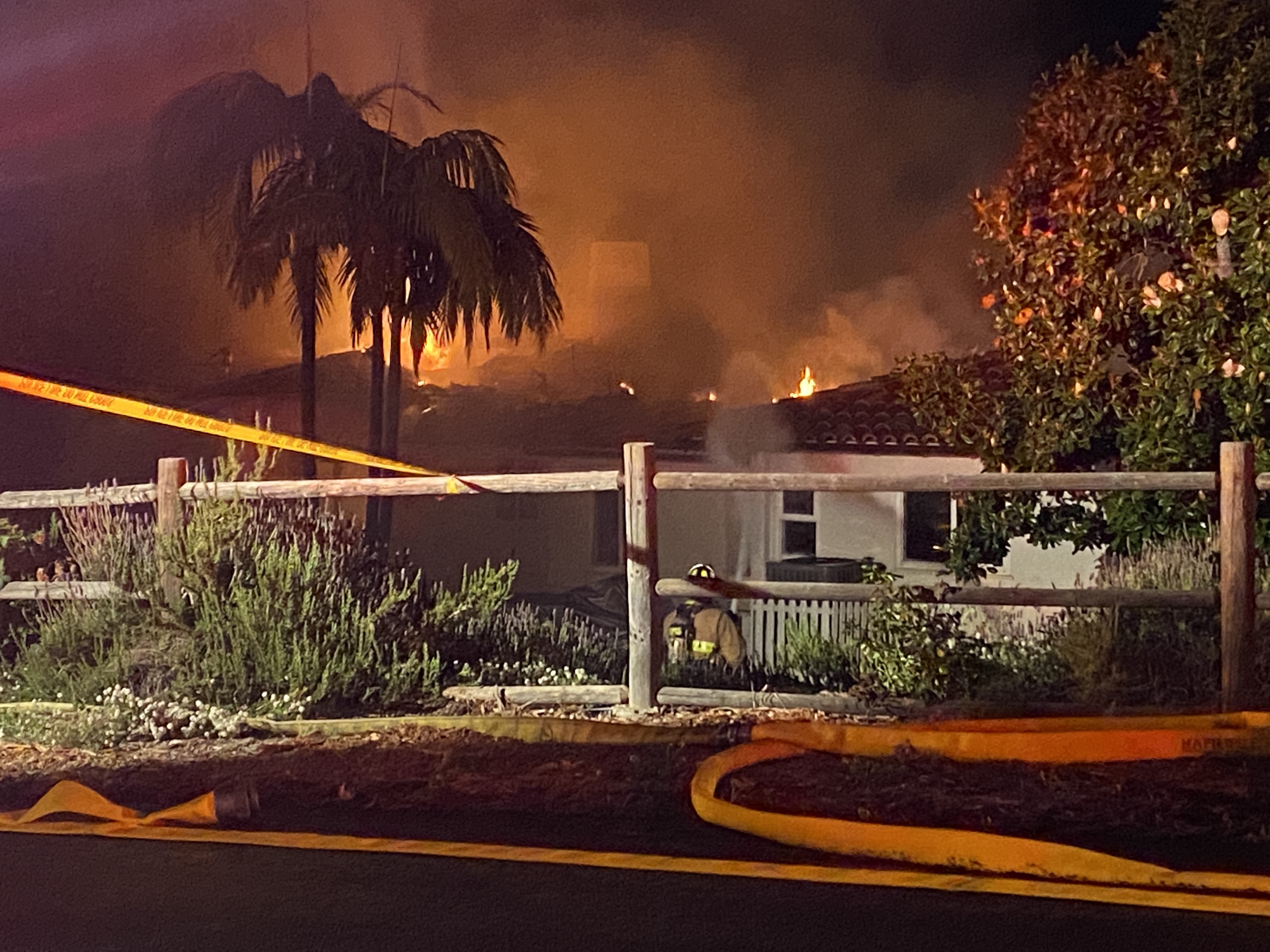 Firefighters respond to a fire at a home in Escondido on Thursday, June 15, 2023.