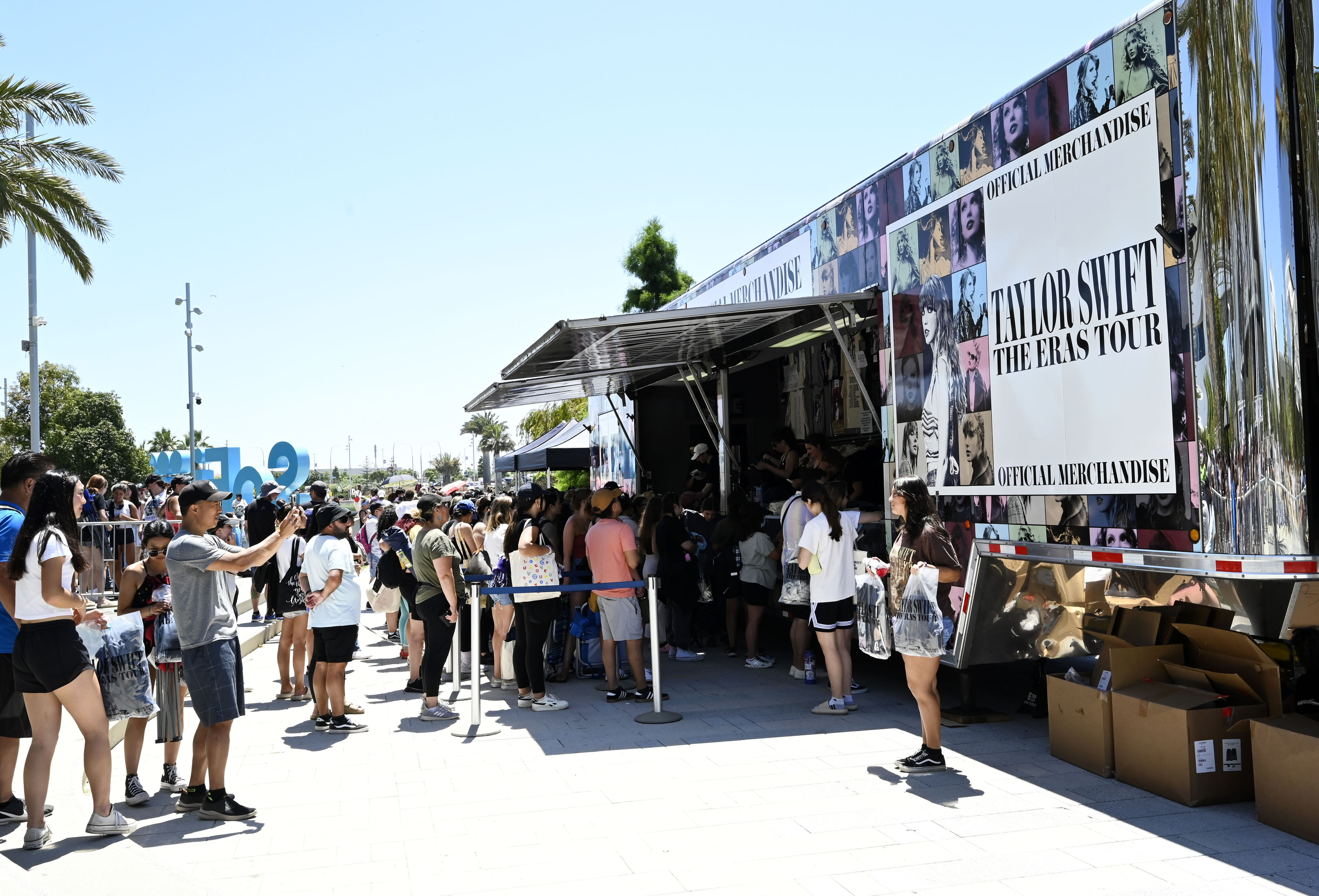A crew of hard working people were busy filling orders as fans lined up by the thousands to purchase Taylor Swift merchandise at SoFi Stadium in Inglewood on Wednesday, August 2, 2023.