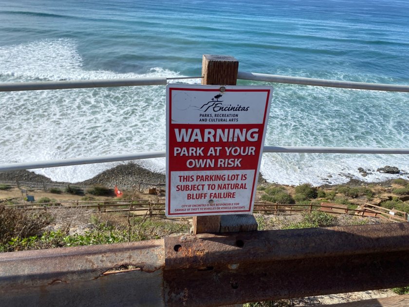 A closed sign is seen above the trail down to Beacon's Beach in Encinitas, Jan. 15, 2024.