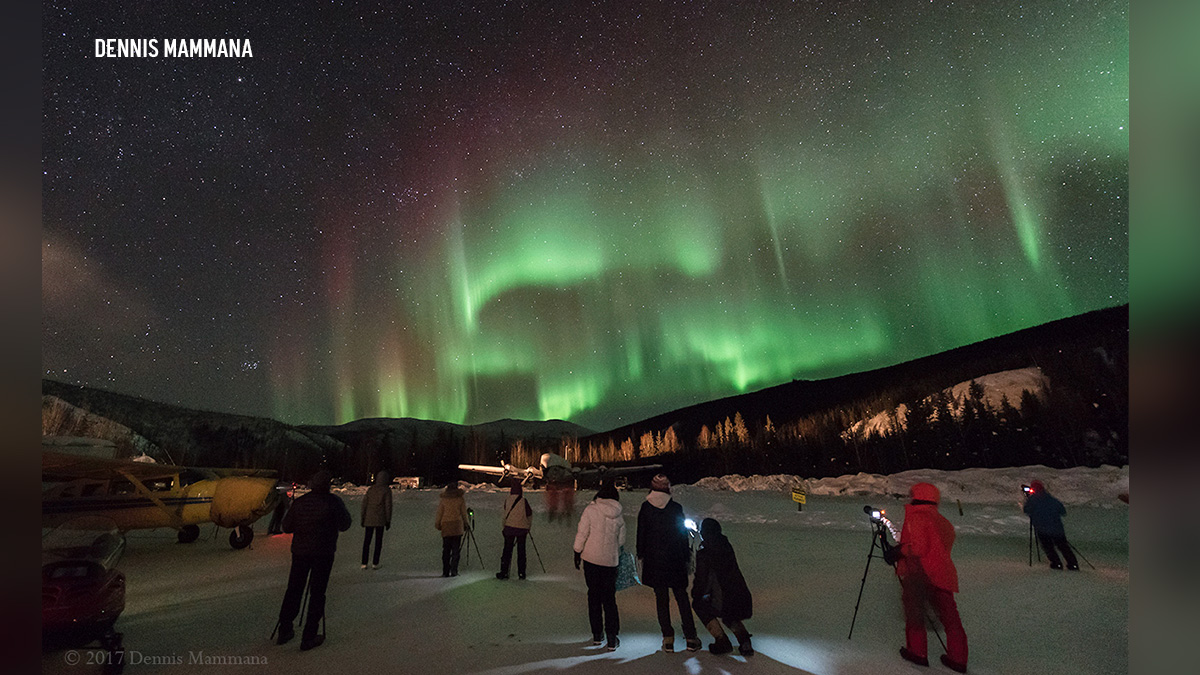 Aurora Borealis watchers are seen in this image taken by Dennis Mammana, 2017.