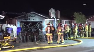 Firefighters respond to the scene of a house fire on Friday, Feb. 14, 2020 in San Diego's Webster neighborhood.