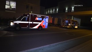 ambulance sits in front of building
