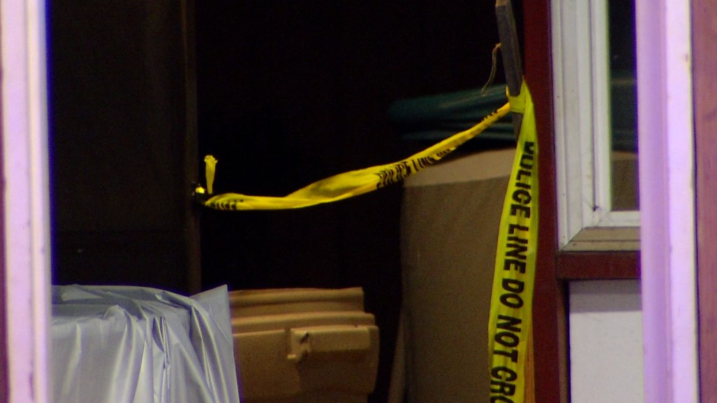 Picture of caution tape at the home where the shooting happend