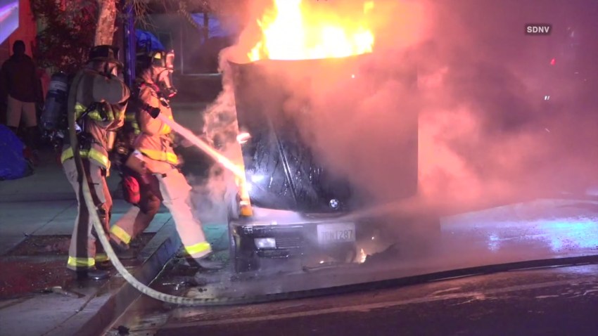 CLIP-SDNV EAST VILLAGE BURNING CAR RESCUE