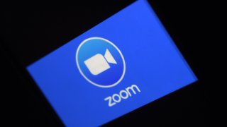 In this March 30, 2020, file photo, a Zoom App logo is displayed on a smartphone in Arlington, Virginia.