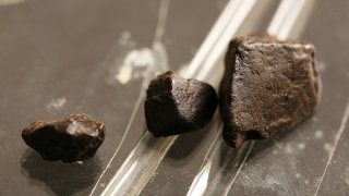 clumps of black tar heroin