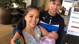 Courtney Flores Holds Baby
