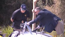 Investigators inspect crash