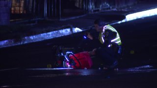 Officer inspects wheelchair during hit-and-run investigation