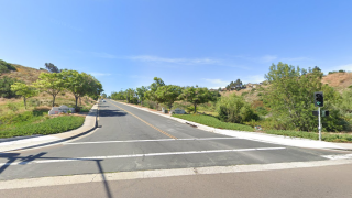 The daytime scene at a Paradise Hills intersection where a deadly crash occurred.