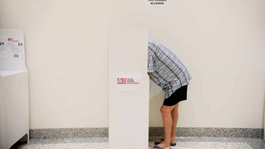 A voter casts his ballot at the San Diego County Registrar of Voters