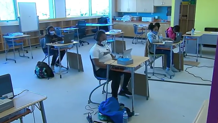 Desks are placed far apart as some DC students return to classrooms