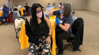 Woman getting vaccinated