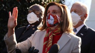 In this Feb. 5, 2021, file photo, Speaker of the House Nancy Pelosi (D-CA) (C) talks to reporters outside the West Wing after she and House Democratic leaders, Majority Whip James Clyburn (D-SC) (L) and Majority Leader Steny Hoyer (D-MD), met with U.S. President Joe Biden to discuss coronavirus relief legislation at the White House in Washington, D.C.