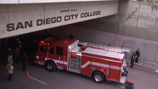 San Diego firefighters and police officers respond to the scene of a crash that left several people injured near San Diego City College in downtown.