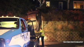 A tow truck assists at the scene of a crash in Escondido on Sunday, April 12, 2021.