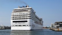 The the 92,409-ton, 16-deck MSC Orchestra cruise ship exits the lagoon as it leaves Venice, Italy