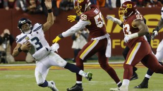 Seattle Seahawks quarterback Russell Wilson (3) is sacked by Washington Football Team defensive end Shaka Toney (58) during the fourth quarter at FedExField.