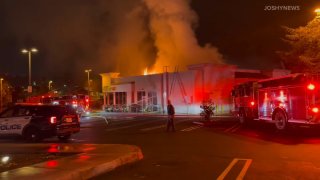 Firefighters battle a blaze at a Rubio's Coastal Grill restaurant in Oceanside on Thursday, Dec. 9, 2021.