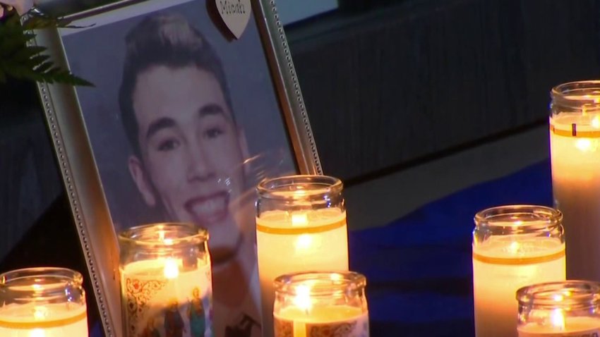 A portrait of Chula Vista native Micah Pietila-Wiggs is surrounded by candles during a memorial in his honor on Sunday, Jan. 23, 2022. The South Bay resident died on Saturday, Jan. 22, 2022 in a crash on Interstate 5.