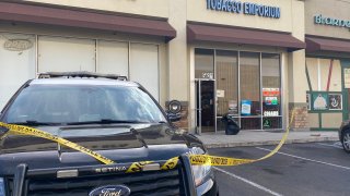 Police investigate the scene of an overnight burglary at a Clairemont tobacco shop on Friday, Jan. 28, 2022.