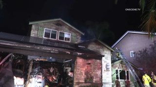 Firefighters respond to a house fire in San Carlos on Monday, Jan. 24, 2022.