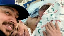 A picture of parents Natalie and Angel Hernandez and their baby boy Ramon who was born on 2:22 p.m. on 2/2/22