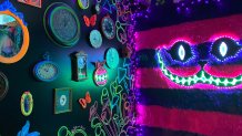 A mischievous smile from the iconic cheshire cat overlooks this portion of The Alice - An Immersive Cocktail Experience pop-up.