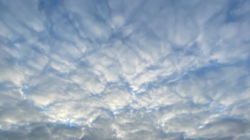Blue skies with fluffy, white clouds rest over San Diego on Friday, April 1, 2022.