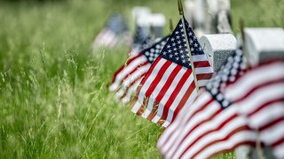 Graves of fallen soldiers, some as old as the Revolutionary War, are dressed with American flags to mark Memorial Day at Green-Wood Cemetery in Brooklyn on May 29, 2022, in New York City.