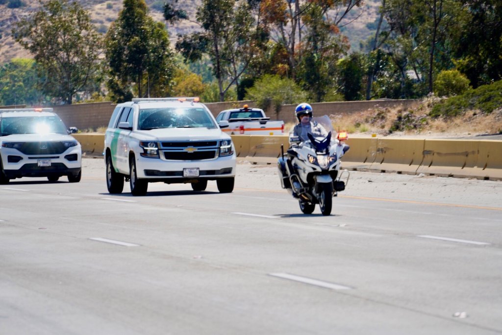 A procession is held on Friday, May 13, 2022 for a U.S. Customs and Border Protection agent who died in a car crash in Campo.