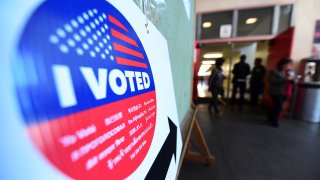 Voters make their way to and from casting their ballots.