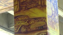 A '65 Chevy Impala is depicted in Chicano Park's latest mural representing the Brown Image Car Club. (July 15, 2022)