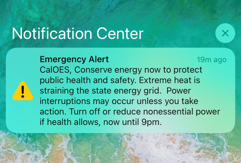 A warning from CalOES is shown on a mobile phone alert, notifying San Diego County residents to conserve energy through 9 p.m., Sept. 6, 2022.