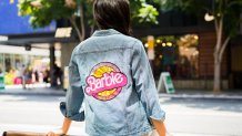 A denim jacket part of the 2022 Barbie Malibu Truck Tour merchandise line.