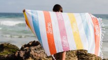 A beach towel part of the 2022 Barbie Malibu Truck Tour merchandise line.