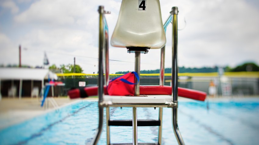 Empty lifeguard tower at swimming pool