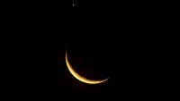 The crescent moon and Venus are pictured in Ungaran, Central Java Province, Indonesia on March 24, 2023, following a lunar occultation of the second planet from the sun. (Photo by WF Sihardian/NurPhoto via Getty Images)