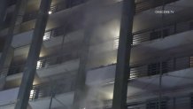 Smoke coming from a unit on the eighth floor of a high-rise building in National City, as seen on Monday, April 17, 2023.