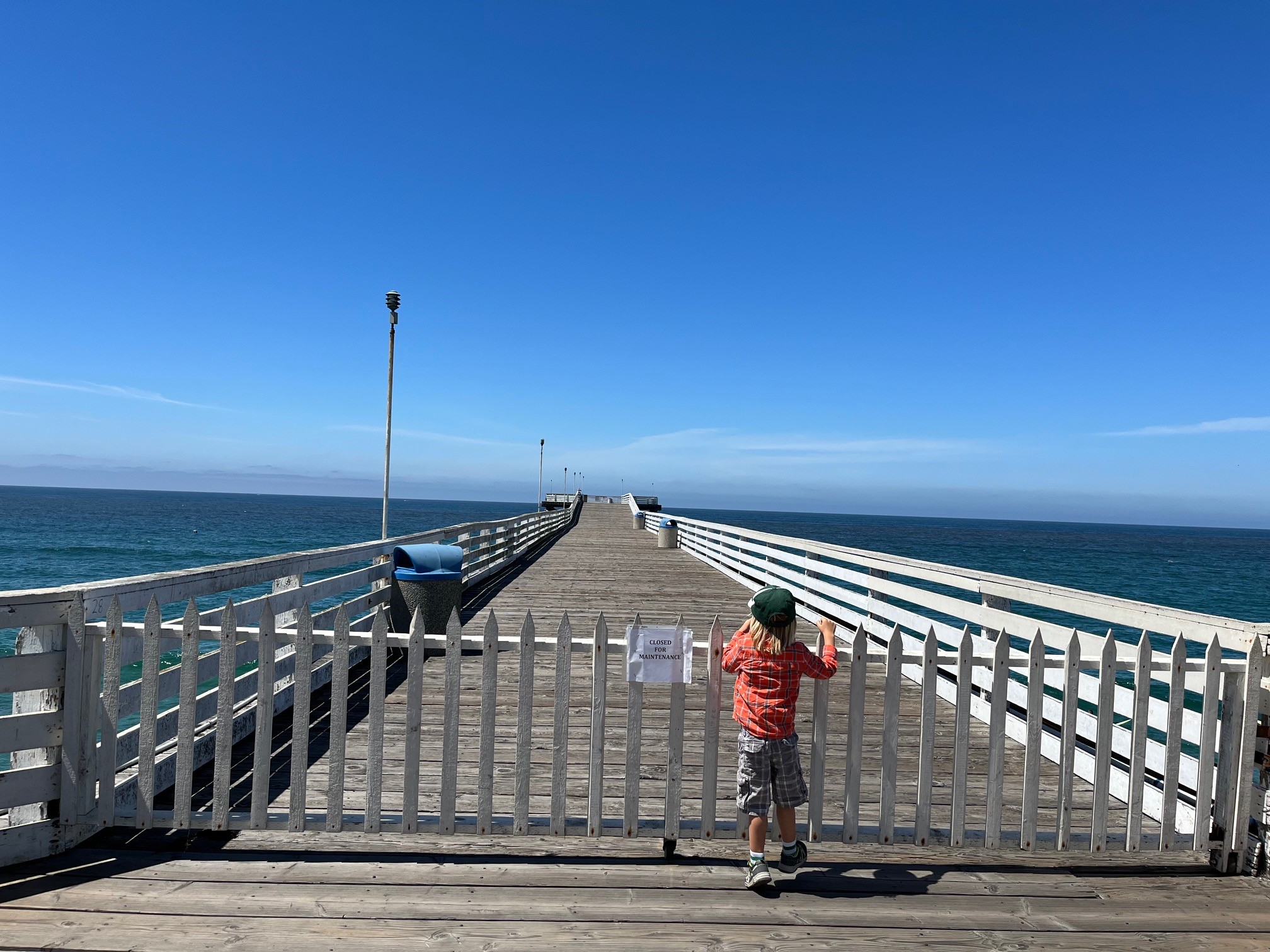 A child looks out at Crystal Pier, which was also closed for a portion of 2023.