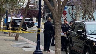 Police officers at the scene of the shooting at the downtown library