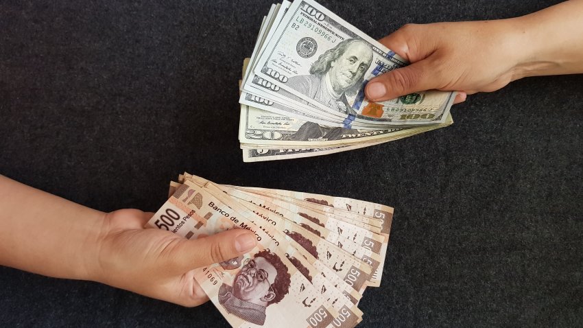 hands on currency exchange, mexican bills and dollar banknotes