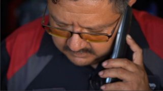 Juan Lemus mechanic in City heights on the phone
