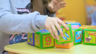 A child plays with blocks.