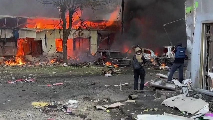 Buildings burn after Russian missile hit a Ukrainian market