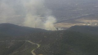 The fire began burning Friday morning in Otay Mesa.