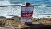 A closed sign is seen above the trail down to Beacon's Beach in Encinitas, Jan. 15, 2024.