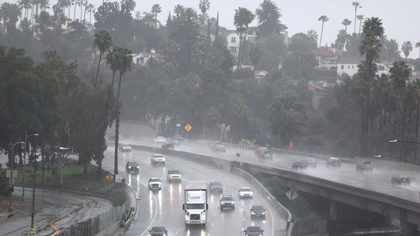 Vehicles drive through the rain on the 101 Freeway on February 19, 2024 in Los Angeles.