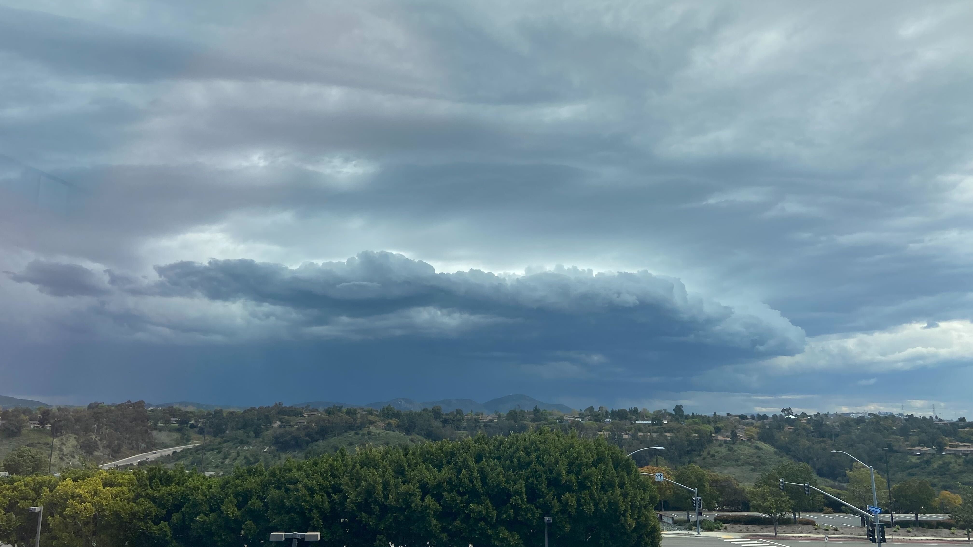 A storm cloud over Tierrasanta looking east from Kearny Mesa on March 18, 2024.