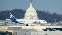 An Alaska Airlines Boeing 737-800 jet flies past the U.S. Capitol dome as it comes in for a landing at Washington Reagan National airport in Arlington, Va., on Feb, 15, 2024.